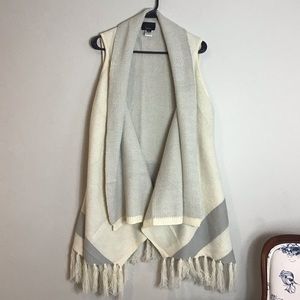 LUMIERE with fringe poncho